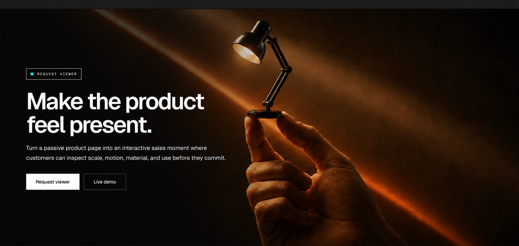 Cinematic REALGINE Anglepoise product-viewer hero with a miniature desk lamp held between two hands